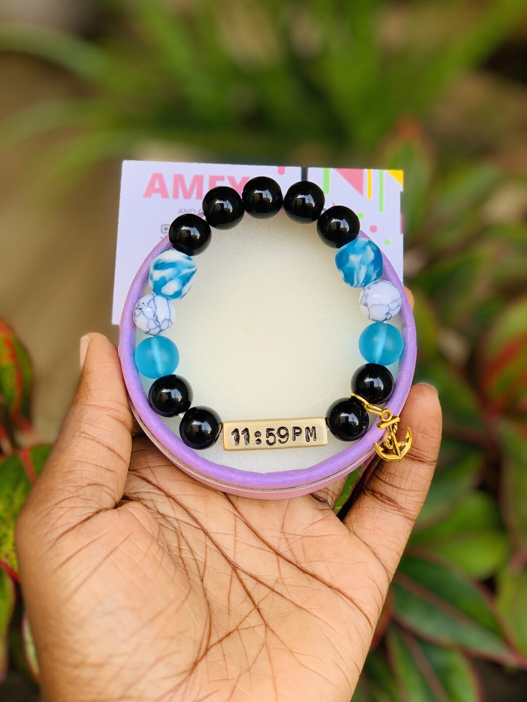 A hand-beaded AMFY bracelet spelling a name, from The Classics collection